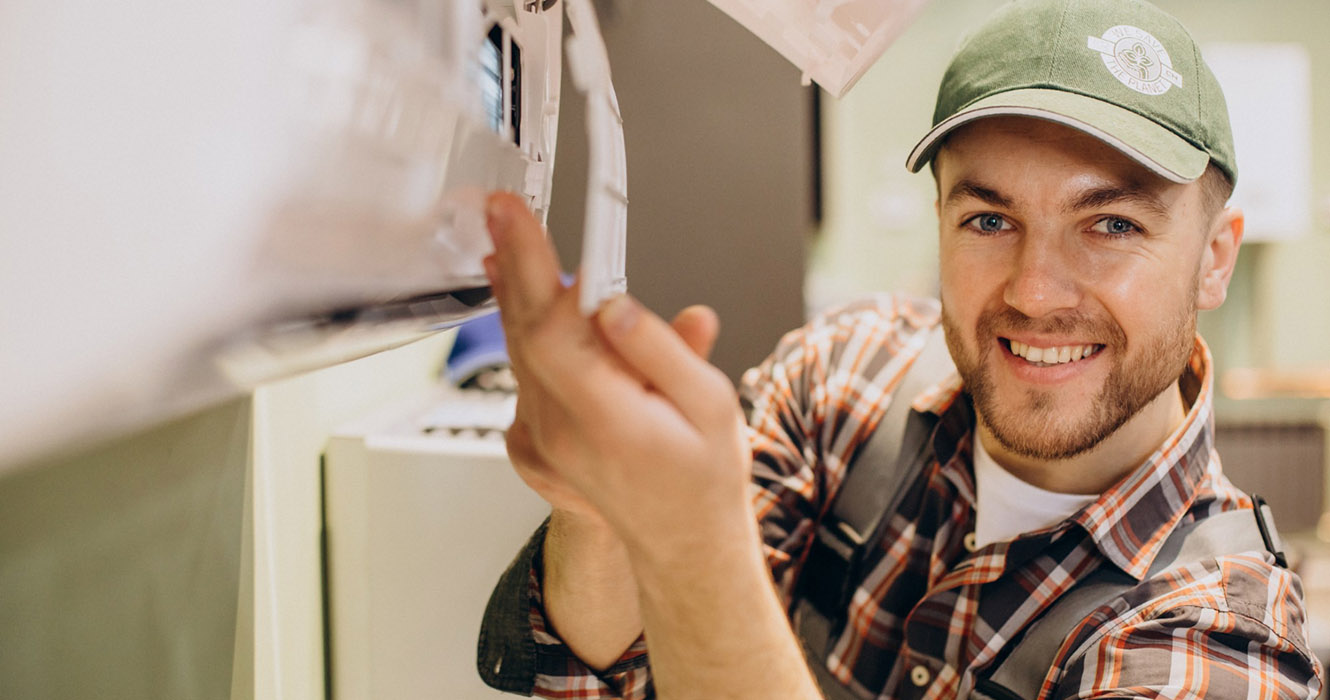 repairman-doing-air-conditioner-service